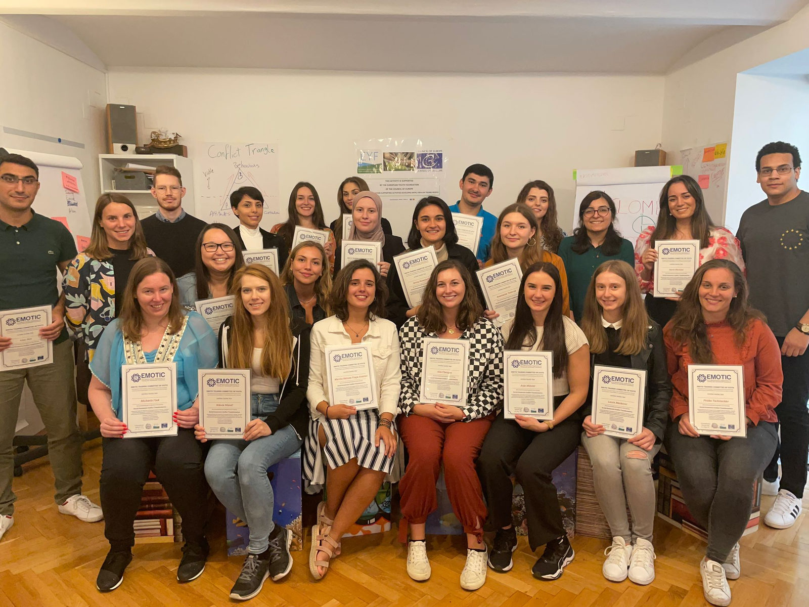 A group of young people holding their certificates