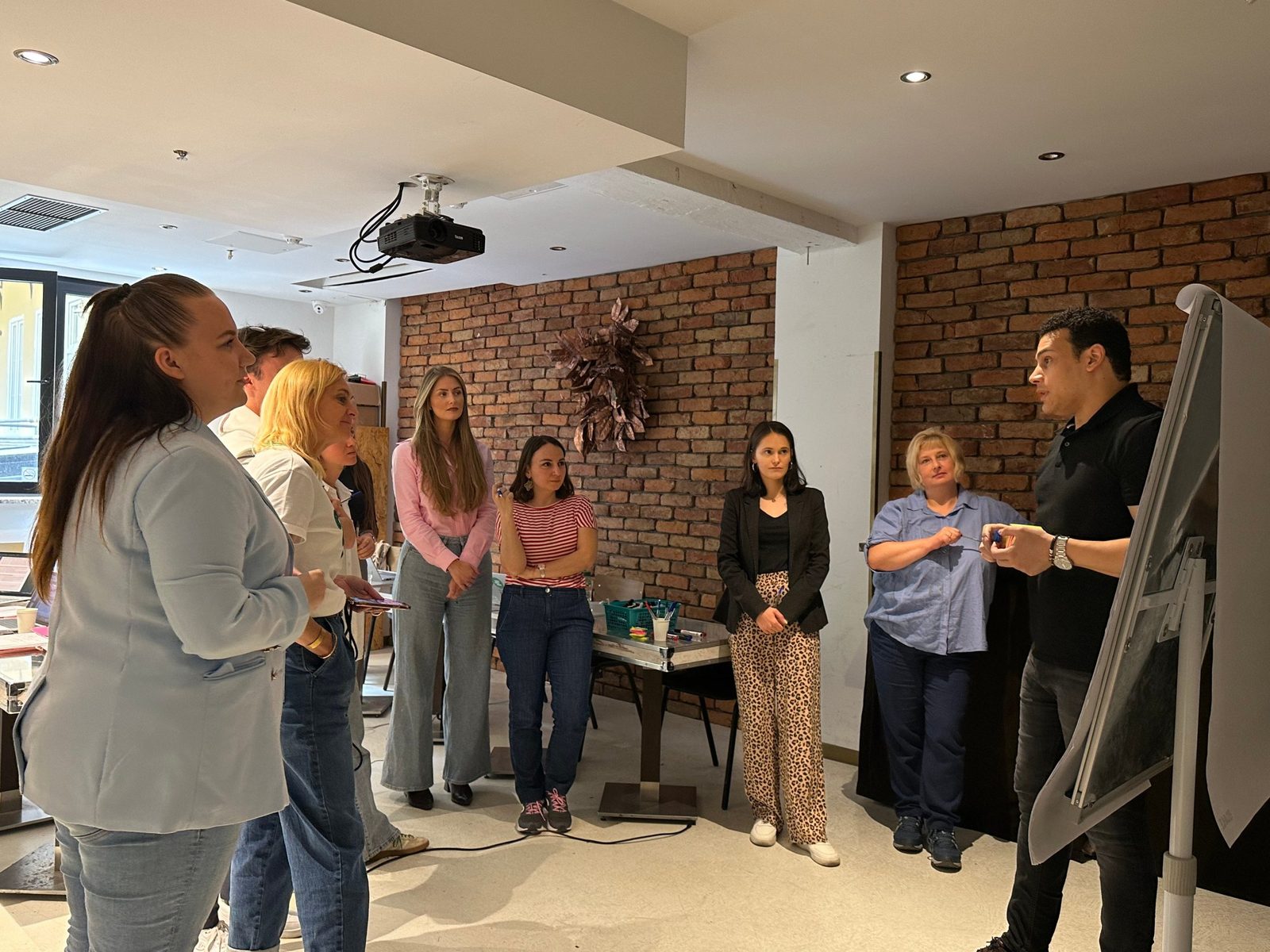 A trainer leading a discussion at the flipchart