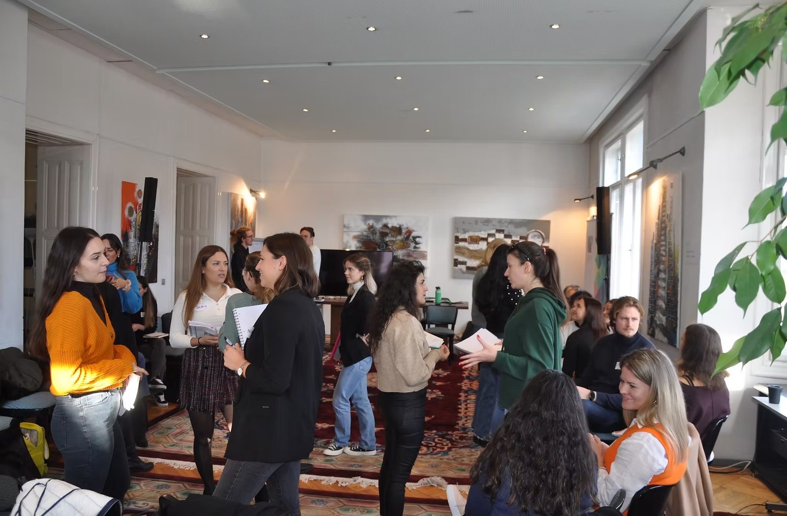 Young people talking in small groups during a workshop